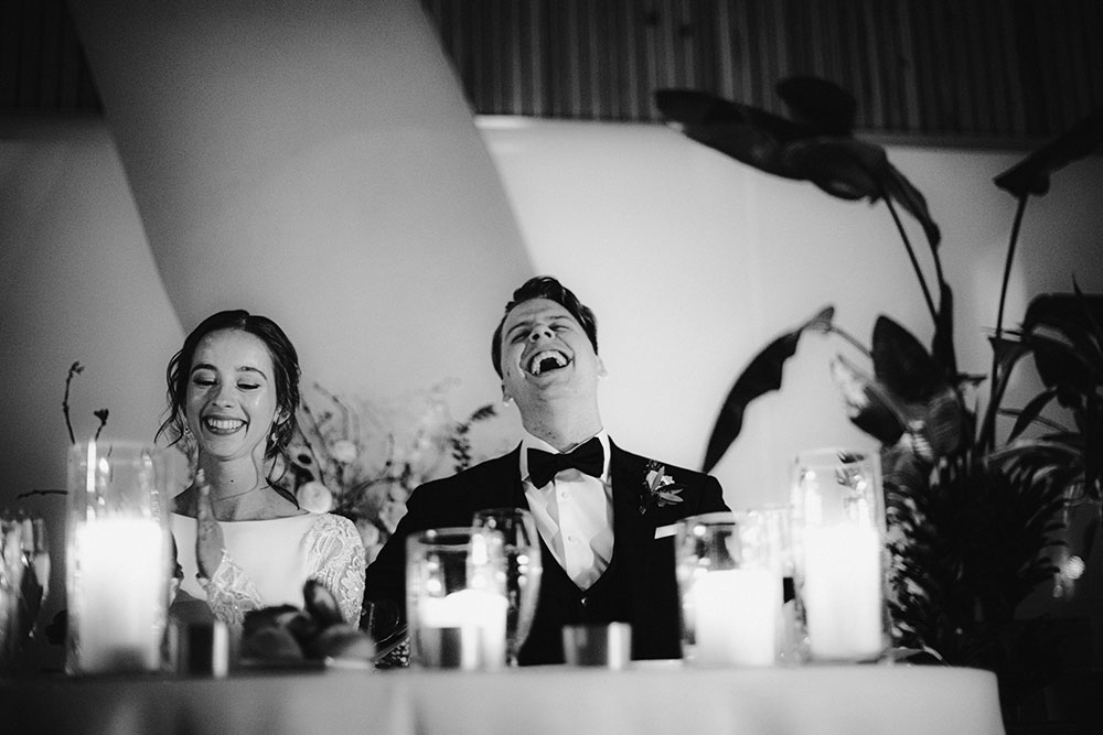 Ricarda's Atrium Toronto Wedding bride & groom laugh at table