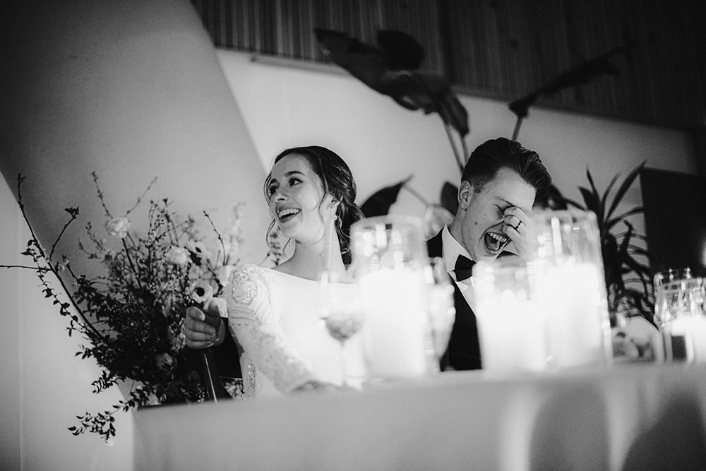 Ricarda's Atrium Toronto Wedding bride & groom laugh at table