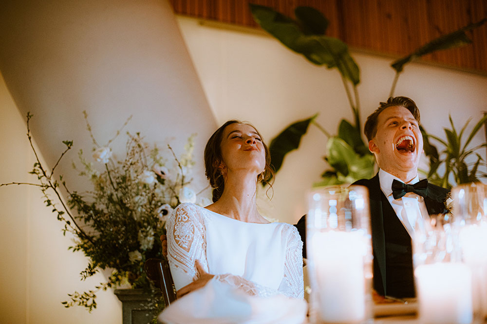 Ricarda's Atrium Toronto Wedding bride & groom laugh at table