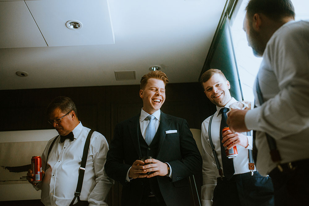 Shangri-La Hotel Toronto Wedding groom laughs with groomsmen