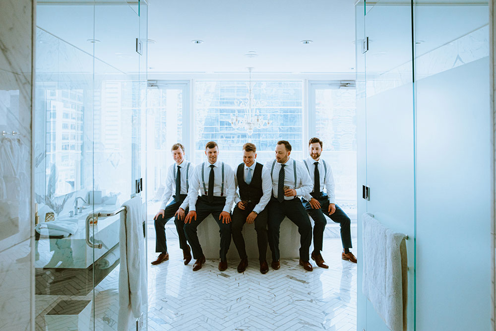 Shangri-La Hotel Toronto Wedding groomsmen pose on suite tub