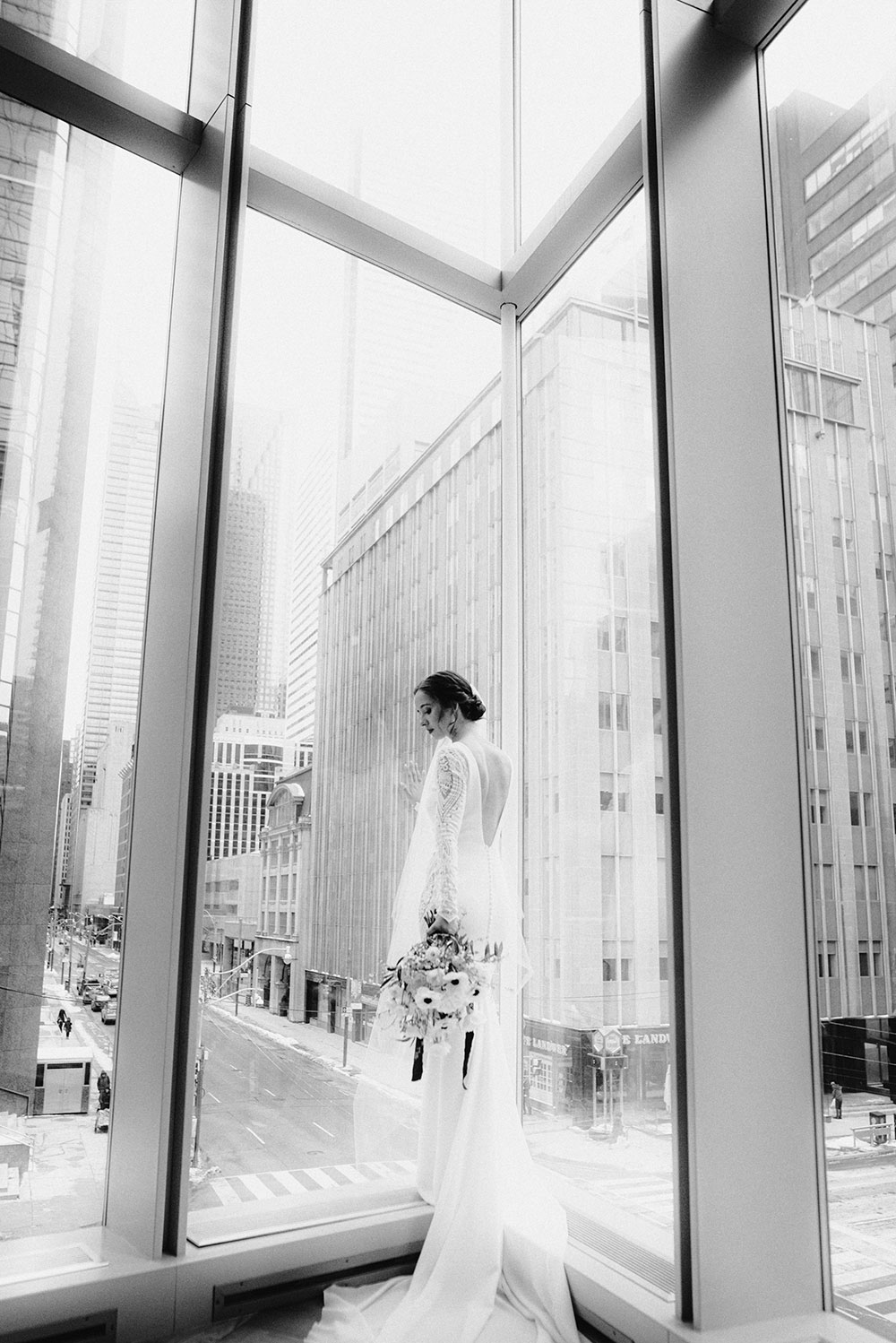 Shangri-La Hotel Toronto Wedding bride poses in museum room