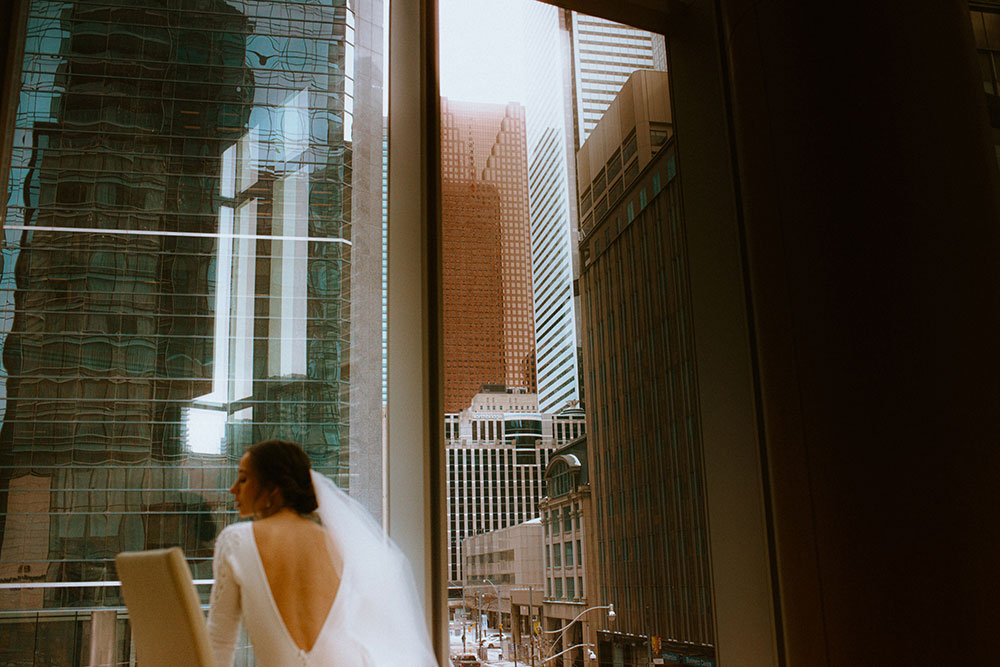 Shangri-La Hotel Toronto Wedding bride poses in museum room