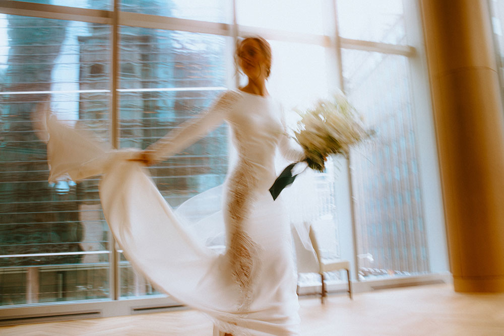 Shangri-La Hotel Toronto Wedding bride poses in museum room