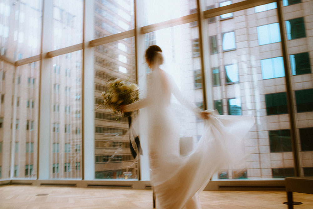 Shangri-La Hotel Toronto Wedding bride poses in museum room