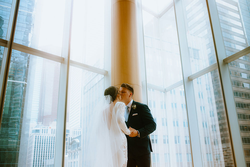 Shangri-La Hotel Toronto Wedding bride & groom poses in museum room