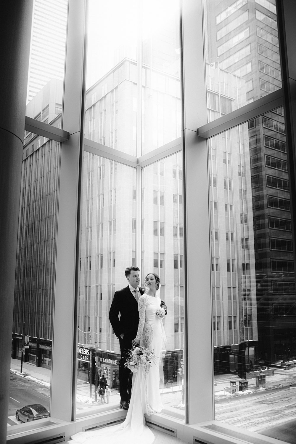 Shangri-La Hotel Toronto Wedding bride & groom poses in museum room