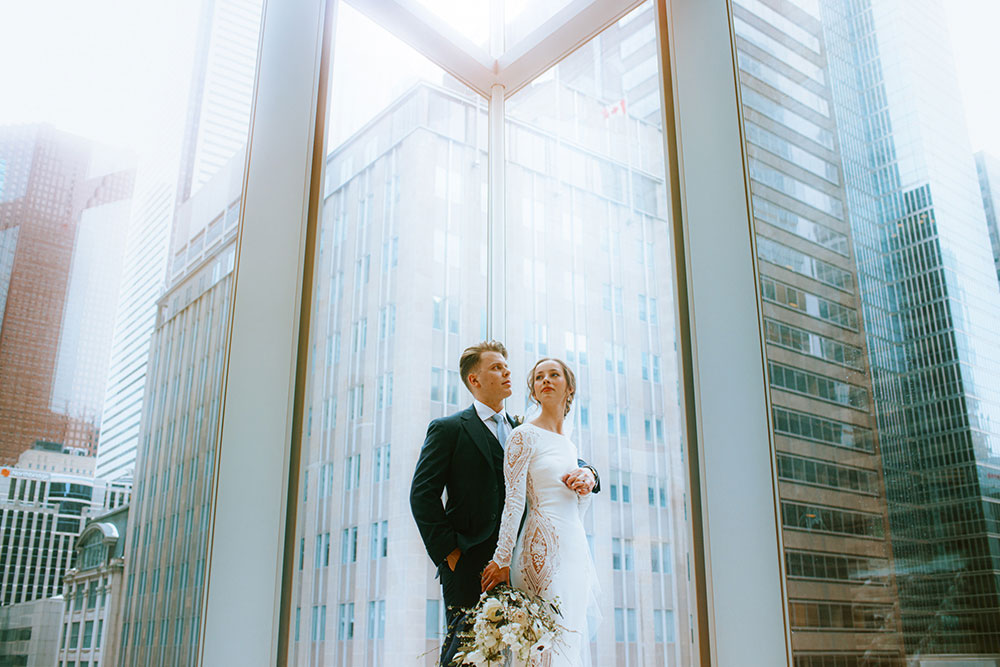 Shangri-La Hotel Toronto Wedding bride & groom poses in museum room