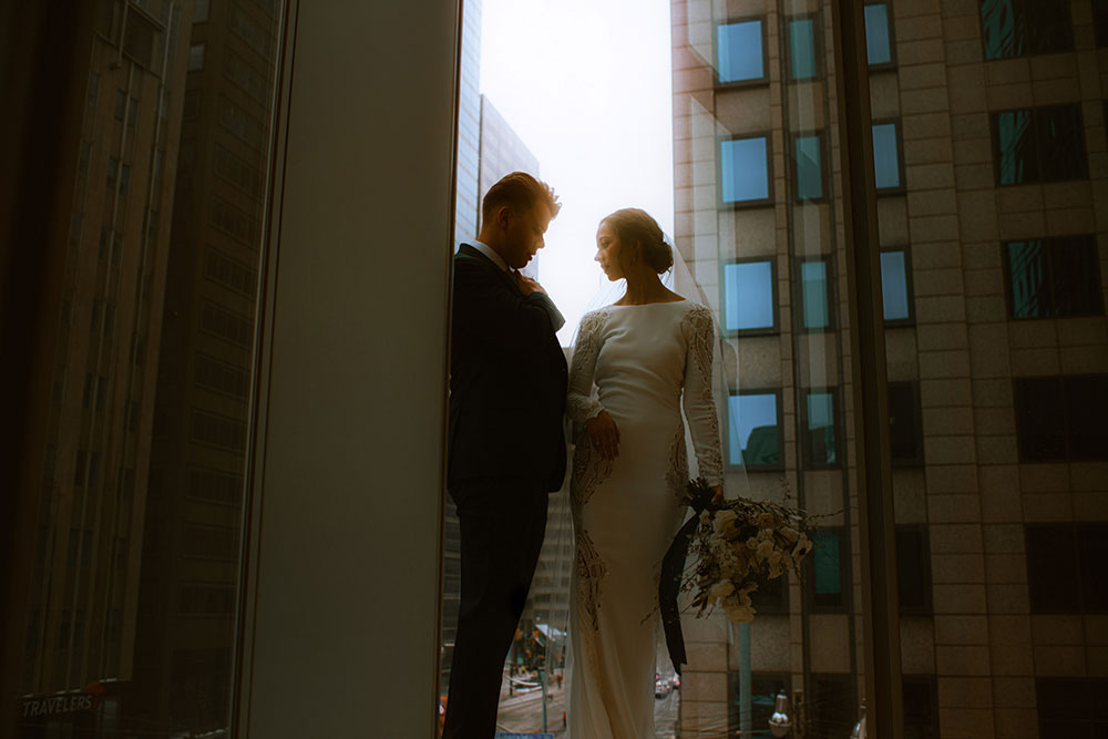 Shangri-La Hotel Toronto Wedding bride & groom poses in museum room