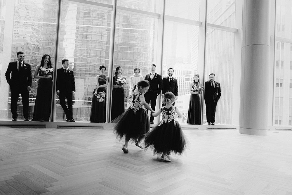 Shangri-La Hotel Toronto Wedding bridal party stands together by window