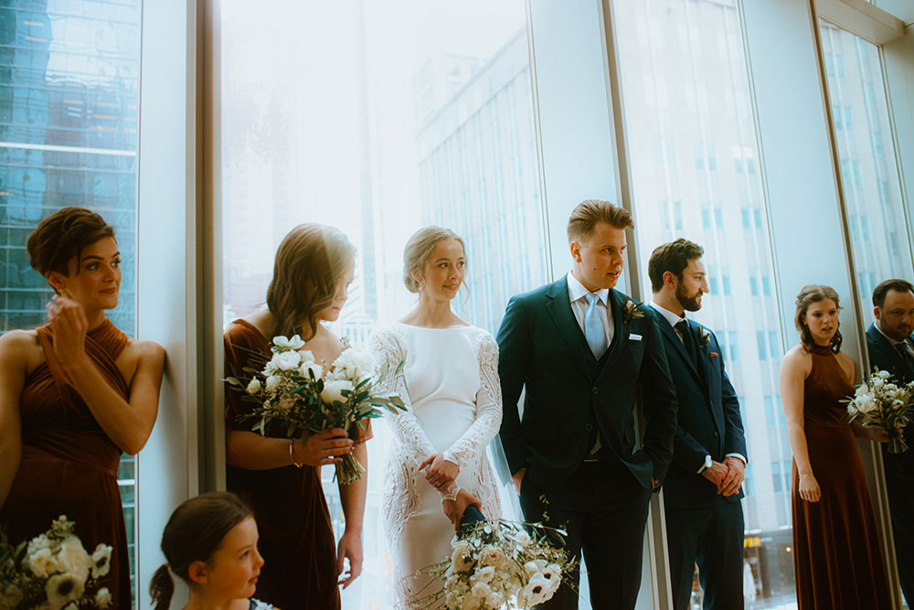 Shangri-La Hotel Toronto Wedding bridal party stands together by window