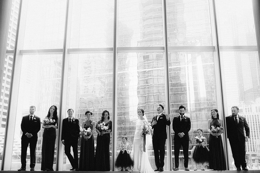 Shangri-La Hotel Toronto Wedding bridal party stands together by window