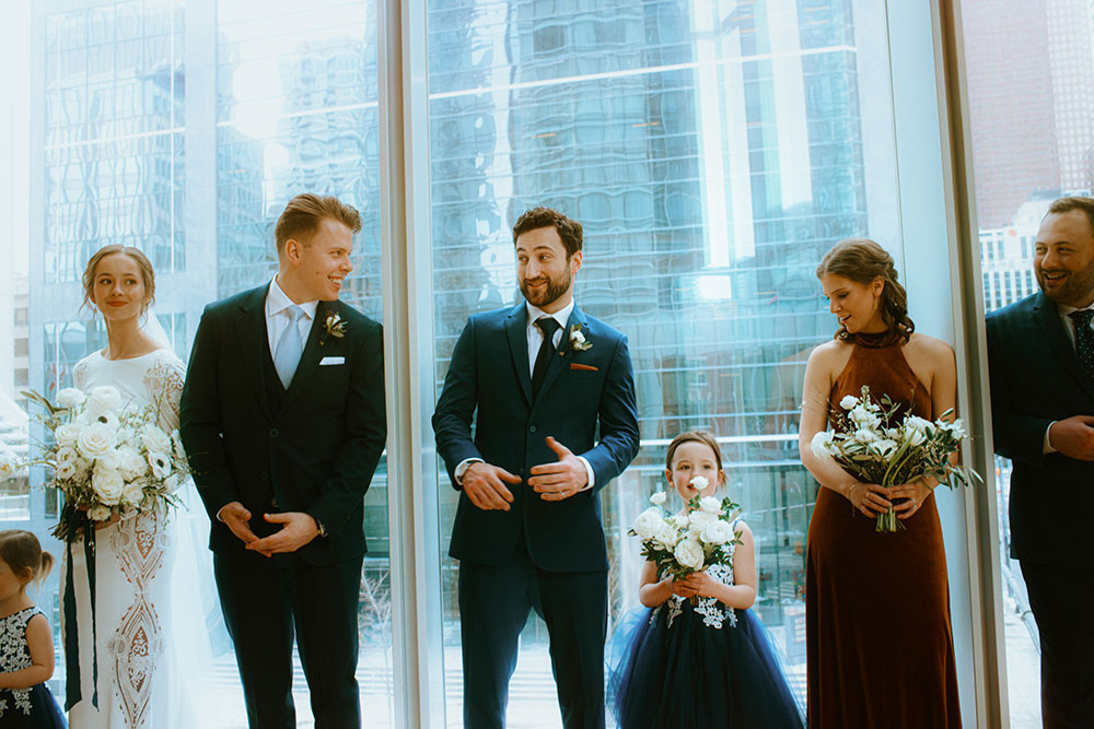 Shangri-La Hotel Toronto Wedding bridal party stands together by window