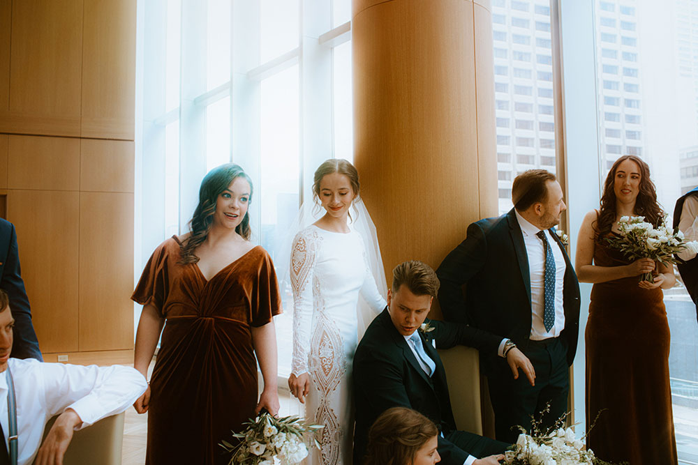 Shangri-La Hotel Toronto Wedding bridal party stands together by window