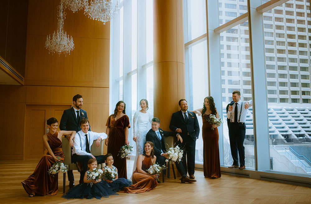 Shangri-La Hotel Toronto Wedding bridal party stands together by window