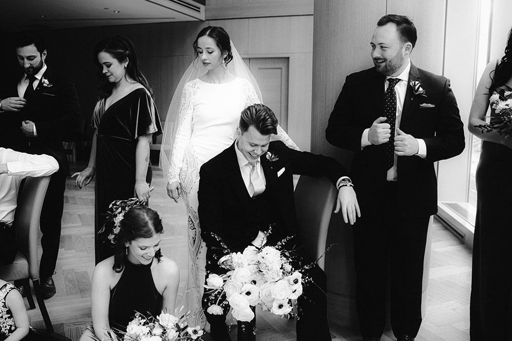 Shangri-La Hotel Toronto Wedding bridal party stands together by window