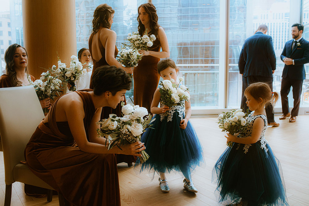 Shangri-La Hotel Toronto Wedding bridal party stands together by window