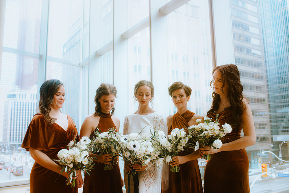 Shangri-La Hotel Toronto Wedding bridal party stands together by window