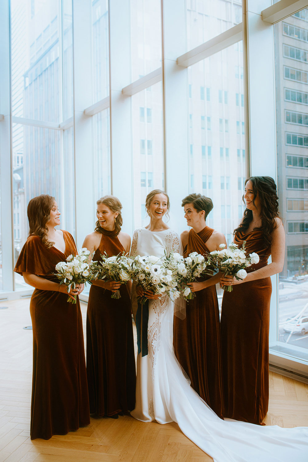 Shangri-La Hotel Toronto Wedding bridal party stands together by window