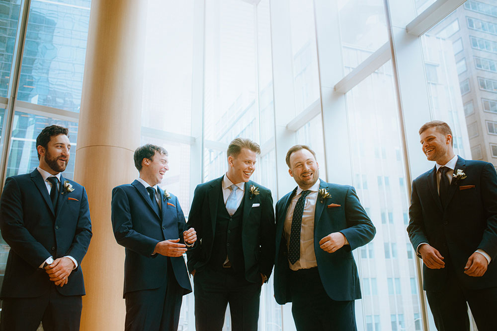 Shangri-La Hotel Toronto Wedding bridal party stands together by window