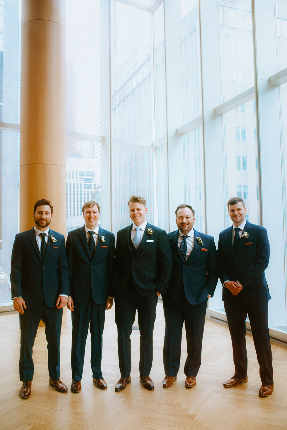 Shangri-La Hotel Toronto Wedding bridal party stands together by window