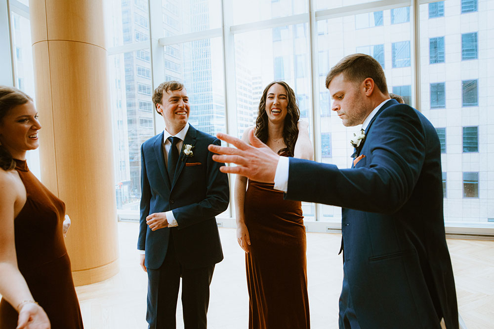 Shangri-La Hotel Toronto Wedding bridal party stands together by window