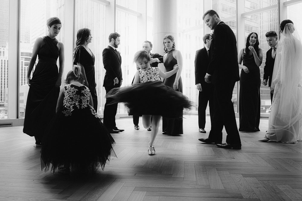 Shangri-La Hotel Toronto Wedding bridal party stands together by window