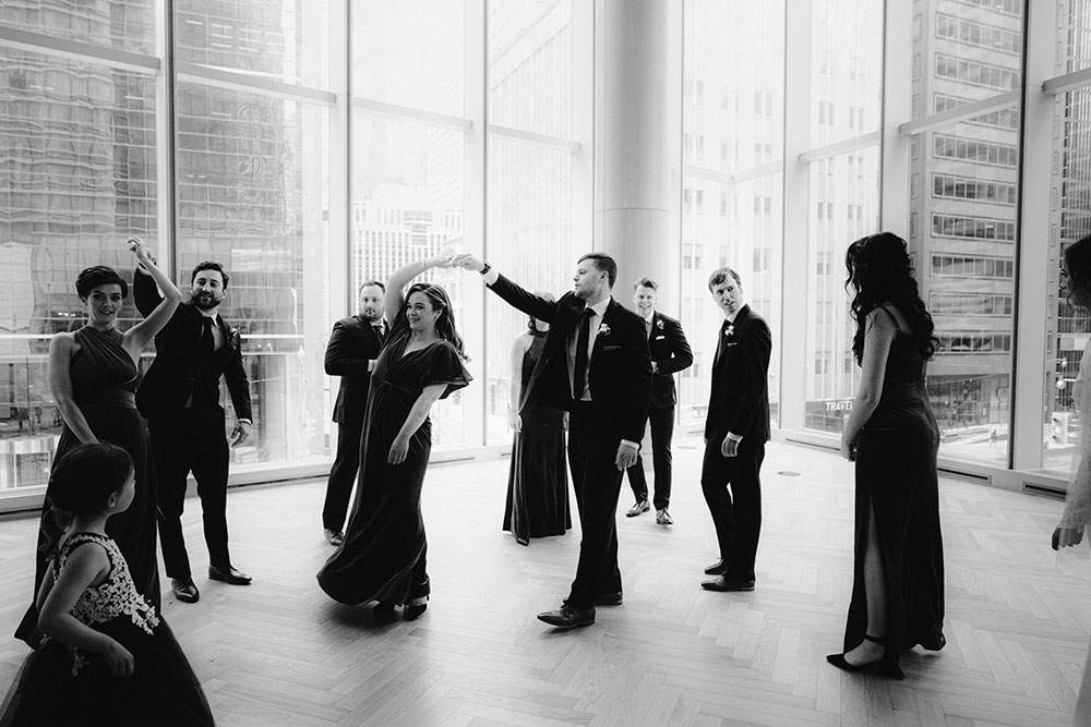 Shangri-La Hotel Toronto Wedding bridal party stands together by window