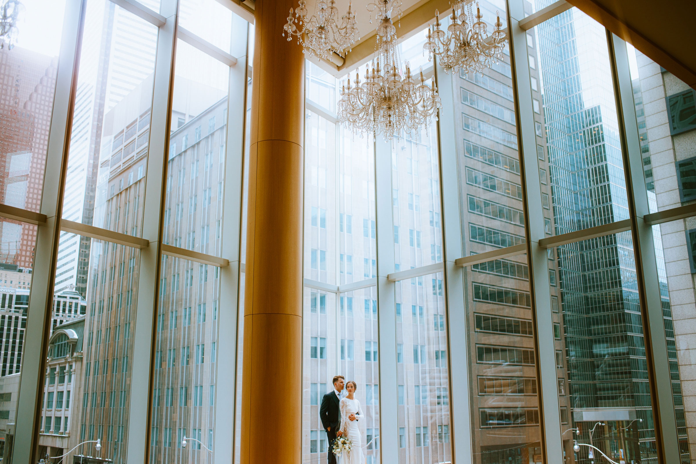 Shangri-La Hotel Toronto Wedding bride & groom poses in museum room