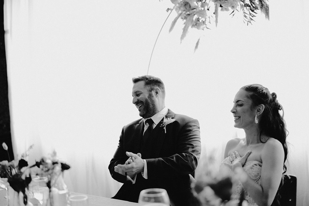 couple laugh during speech at Respect is Burning Kitchen 