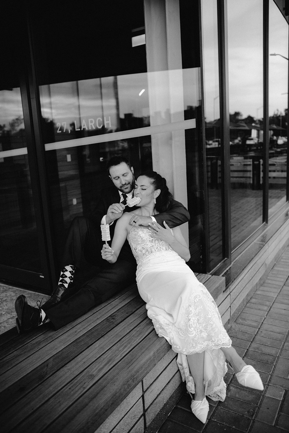 newlyweds enjoy deserts by northern sugar mama while sitting outside Place des artes in Sudbury