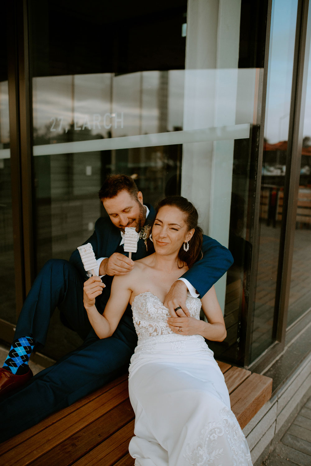 newlyweds enjoy deserts by northern sugar mama while sitting outside Place des artes in Sudbury