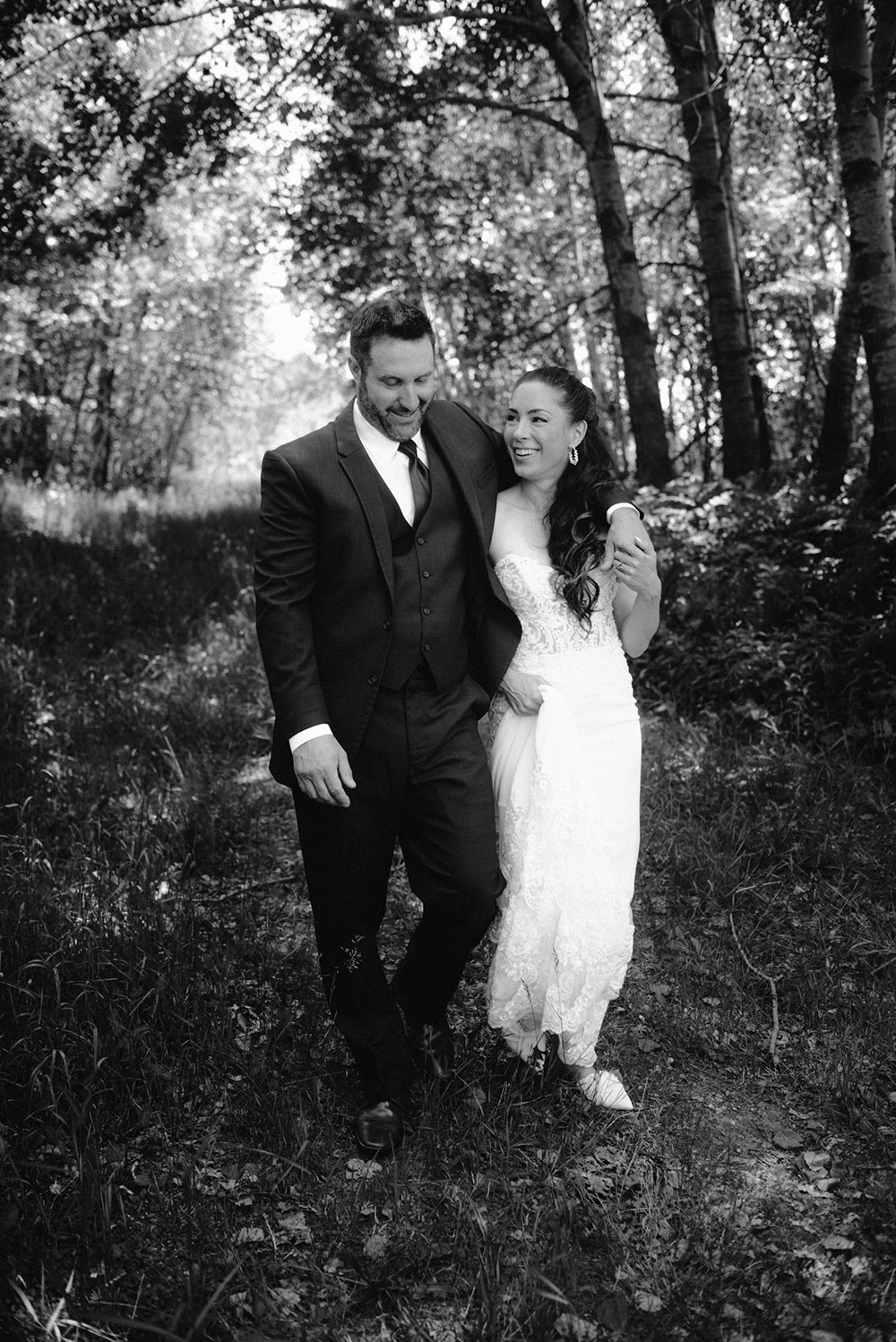 newlyweds take a stroll together after their first look