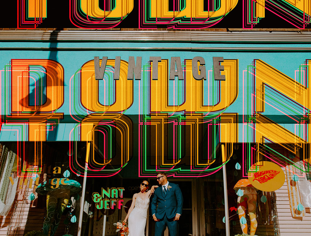 newlyweds pose outside of a vintage shop in Sudbury, ON