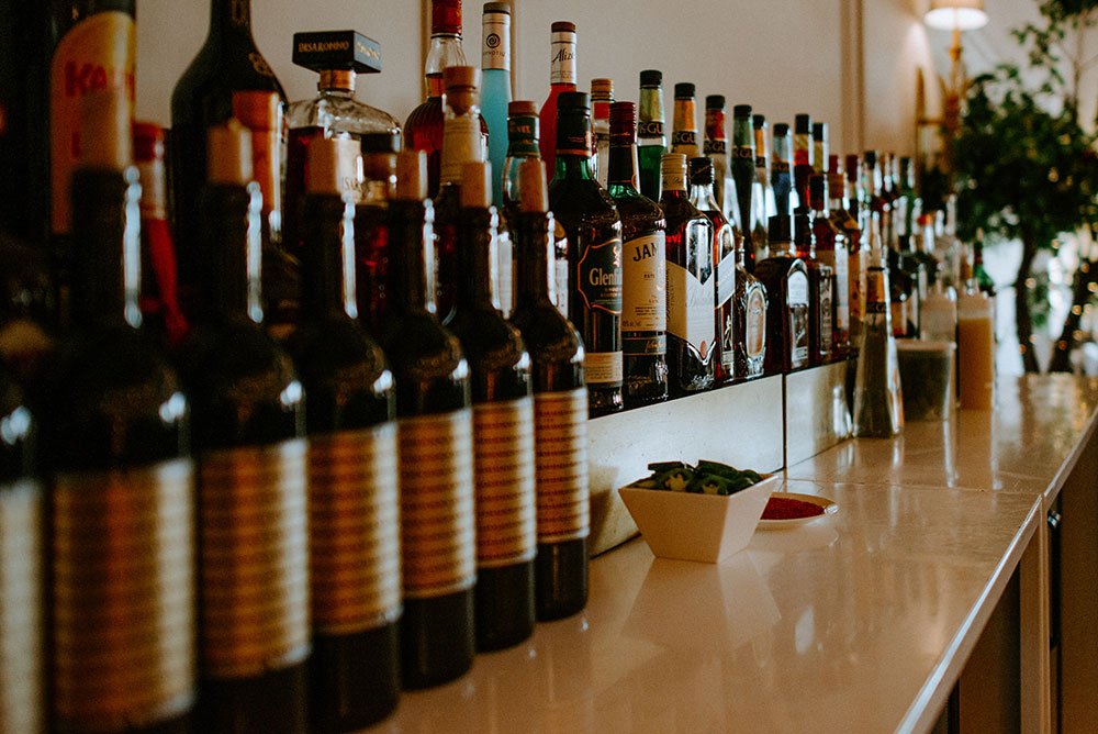 lined up booze bottles at this Arlington Estate wedding