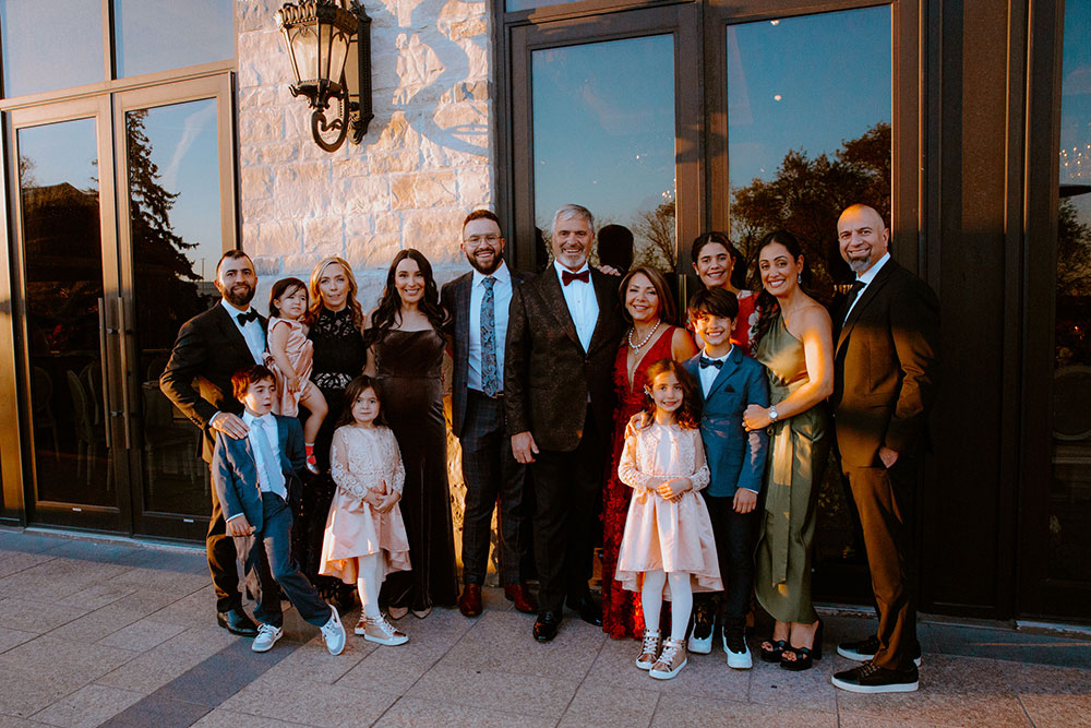 a family poses for a photo at this Arlington Estate wedding