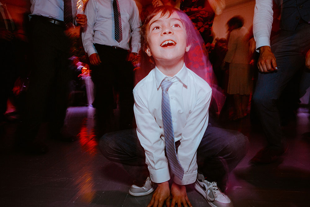 boy does a leapfrog dance move at this Arlington Estate wedding