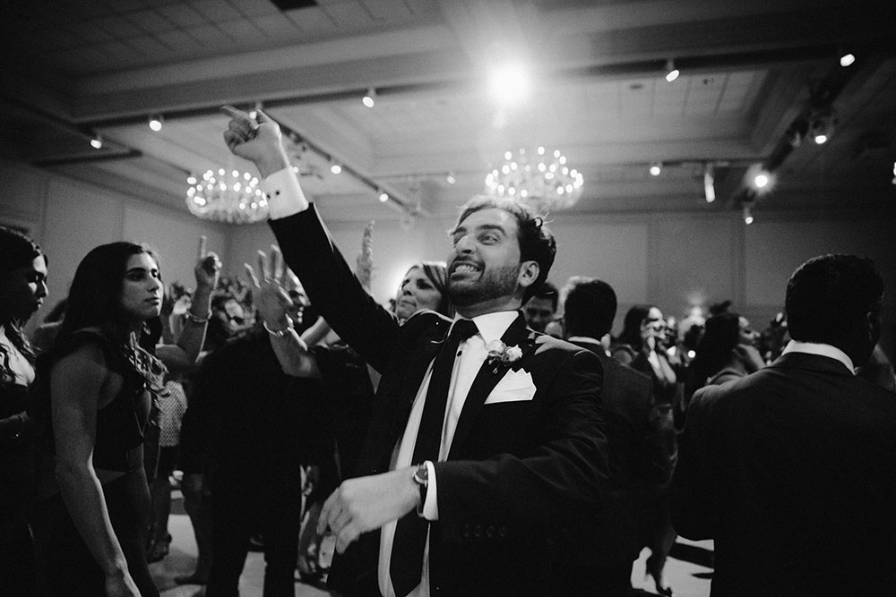 man dances with joy at this Arlington Estate wedding