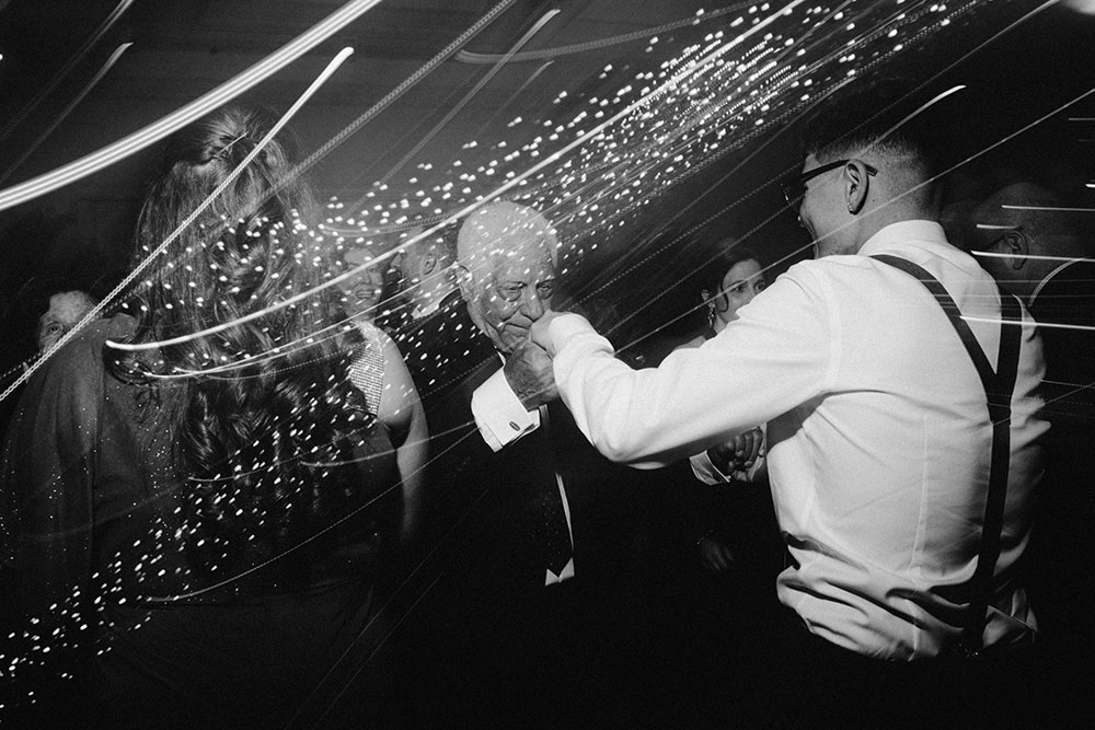 a young man dances with his grandfather at this Arlington Estate wedding