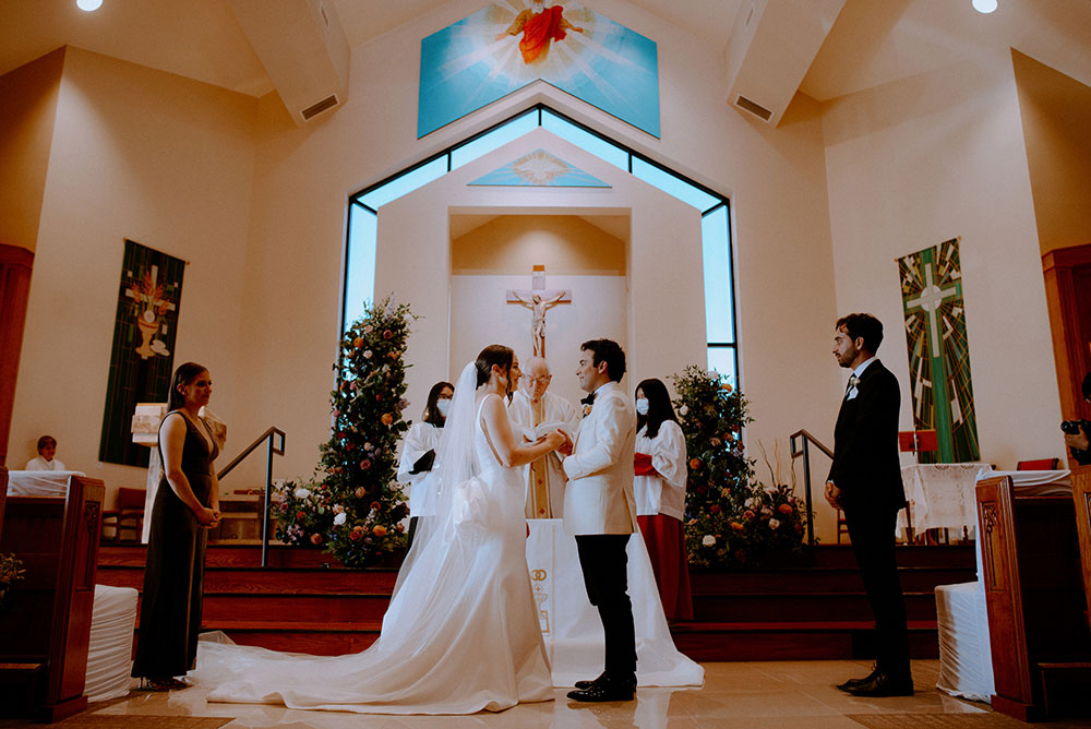 bride at groom at the alter saying I do at this Arlington Estate wedding