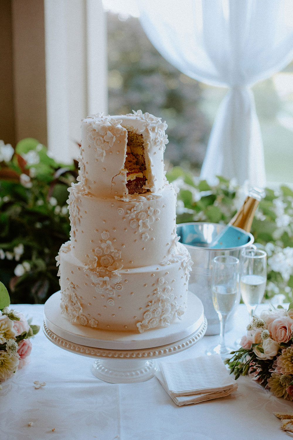 the cake with one slice missing at this Bayview Golf Wedding