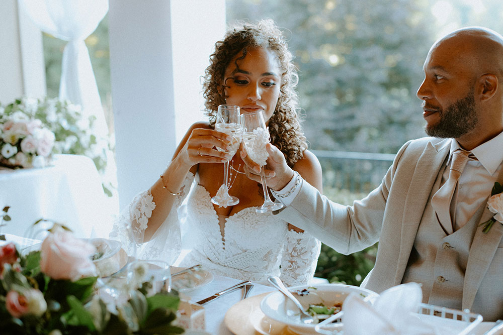 newlyweds cheers at this Bayview Golf Wedding