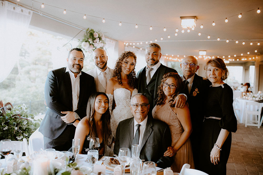 pose for a family portrait together at this Bayview Golf Wedding