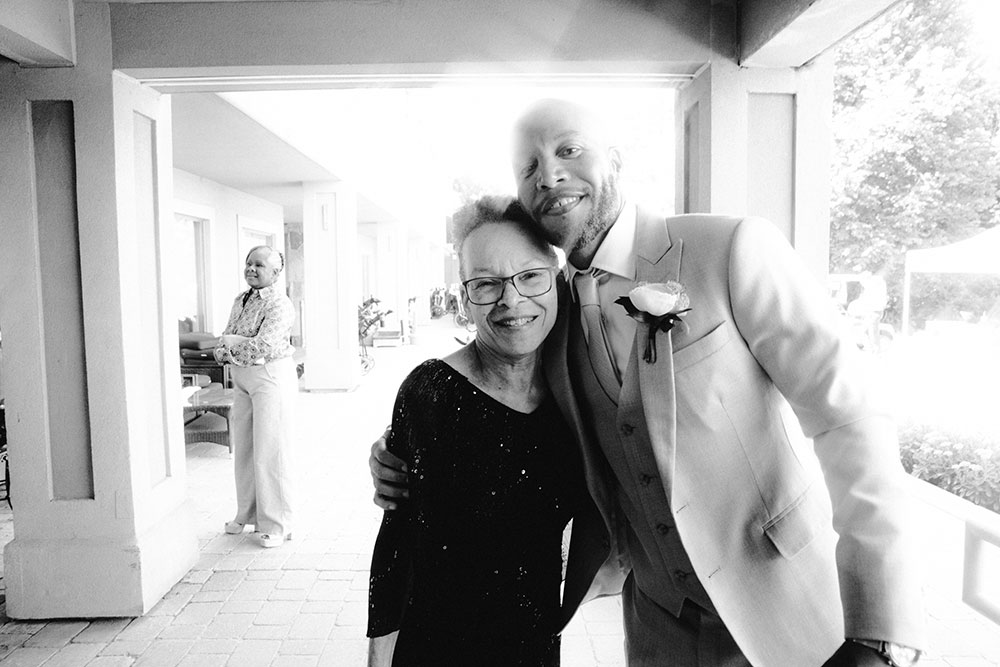 groom poses with his mother at this Bayview Golf Wedding