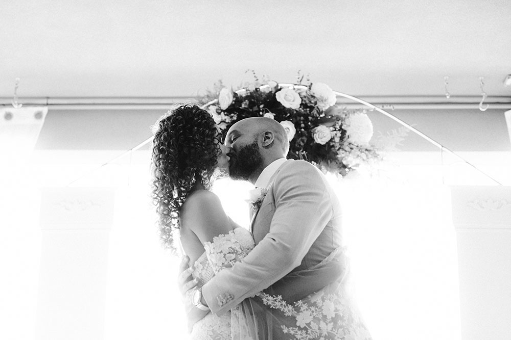 bride and groom seal it with a kiss at this Bayview Golf Wedding