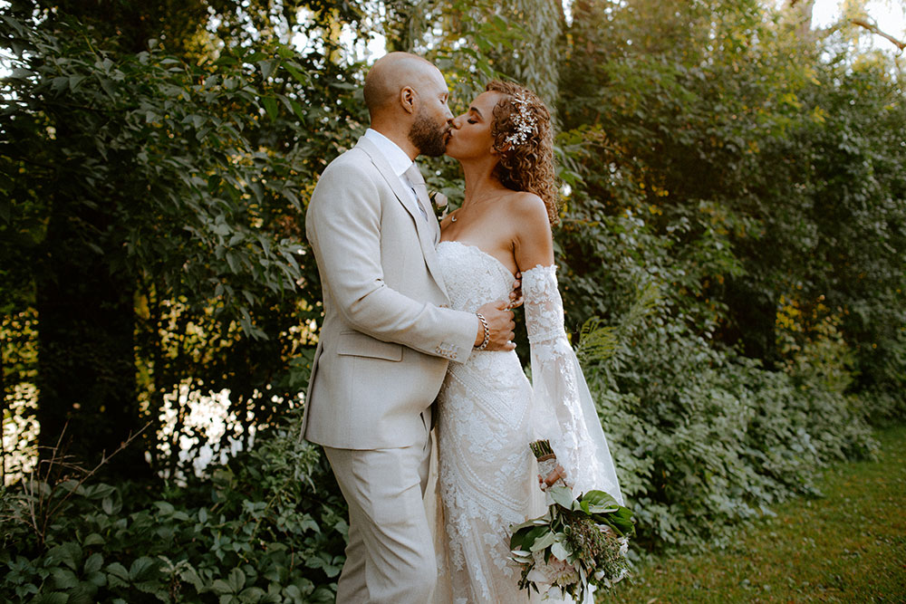 a kiss during portrait time eat the bayview golf wedding