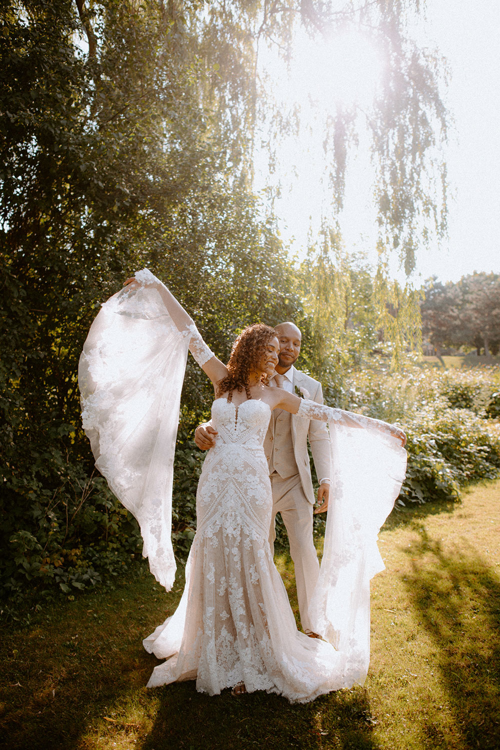 bride waves her arms and dances during portraits at this Bayview Golf Wedding