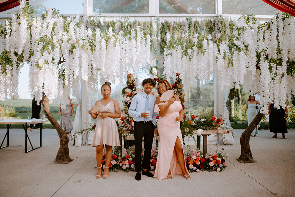 guests pose for a photo at the reception at the Catana Estate