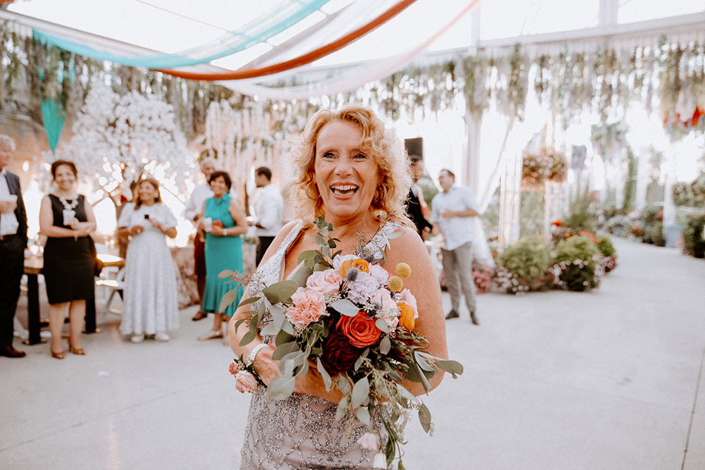 mother of the groom catches the buoquet at the Catana Estate