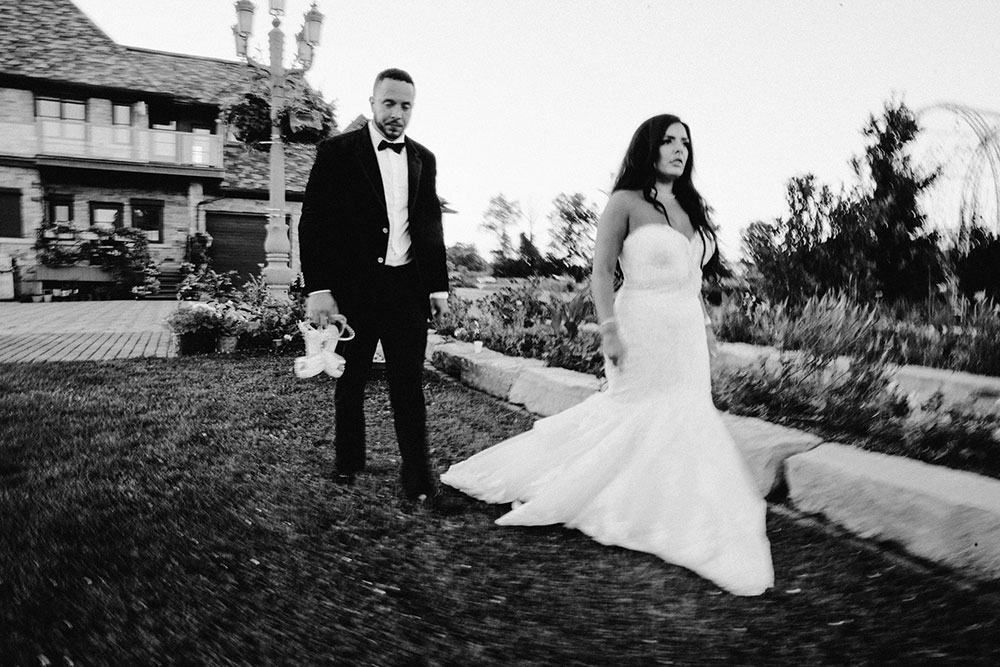 bride and groom walk the grounds at the Catana Estate